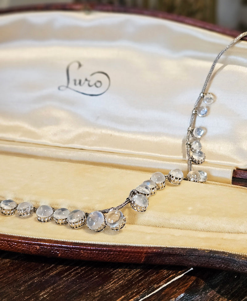 A Victorian Authentic Original Slightly Graduated 23.40ctw Blue Moonstone fringe Roman Woven 10K White Gold Necklace C. 1880s