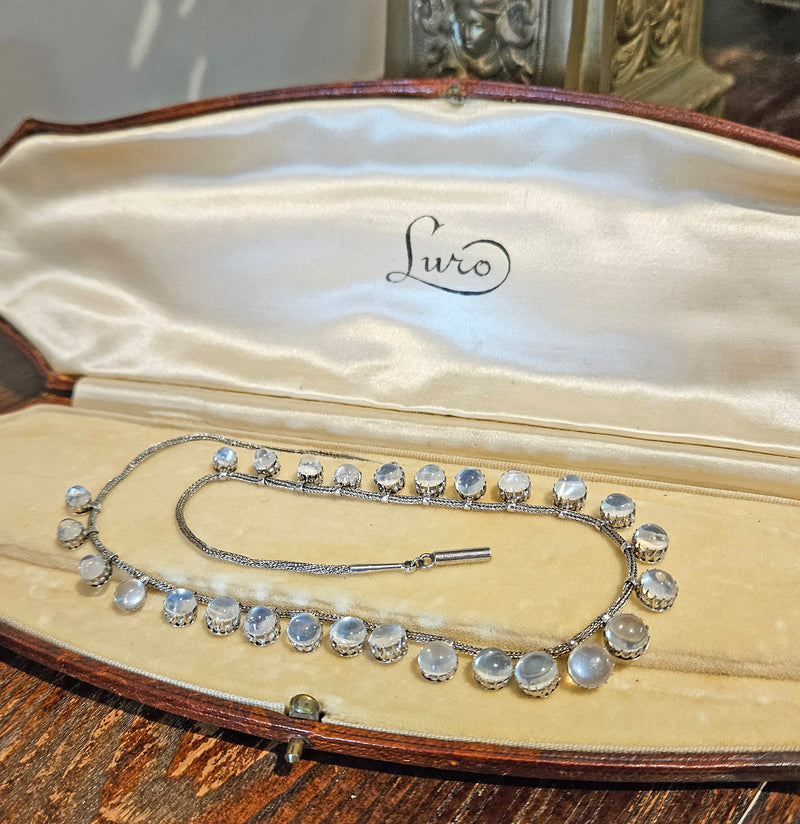 A Victorian Authentic Original Slightly Graduated 23.40ctw Blue Moonstone fringe Roman Woven 10K White Gold Necklace C. 1880s