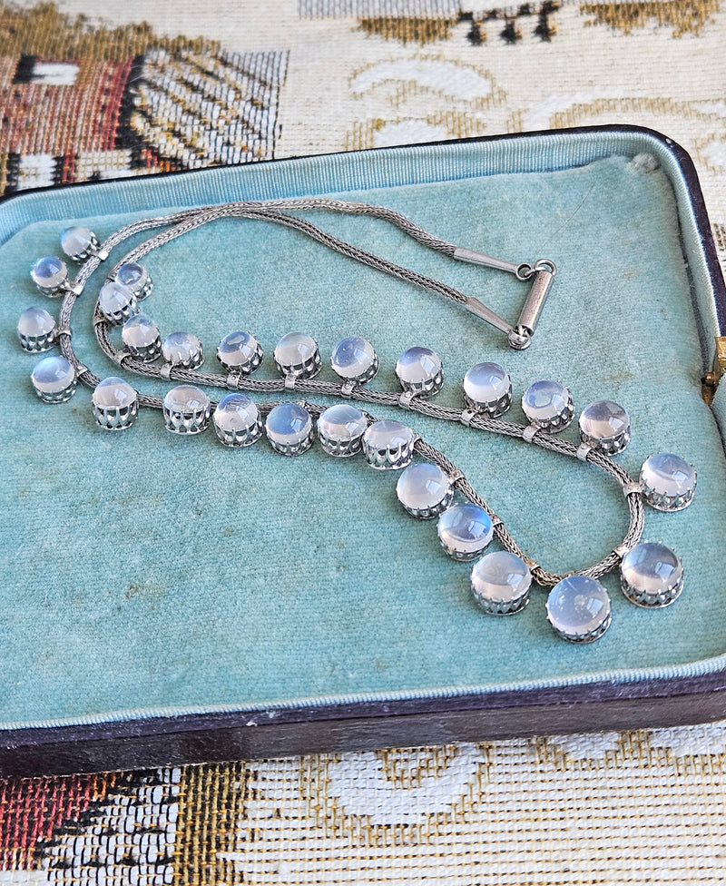 A Victorian Authentic Original Slightly Graduated 23.40ctw Blue Moonstone fringe Roman Woven 10K White Gold Necklace C. 1880s